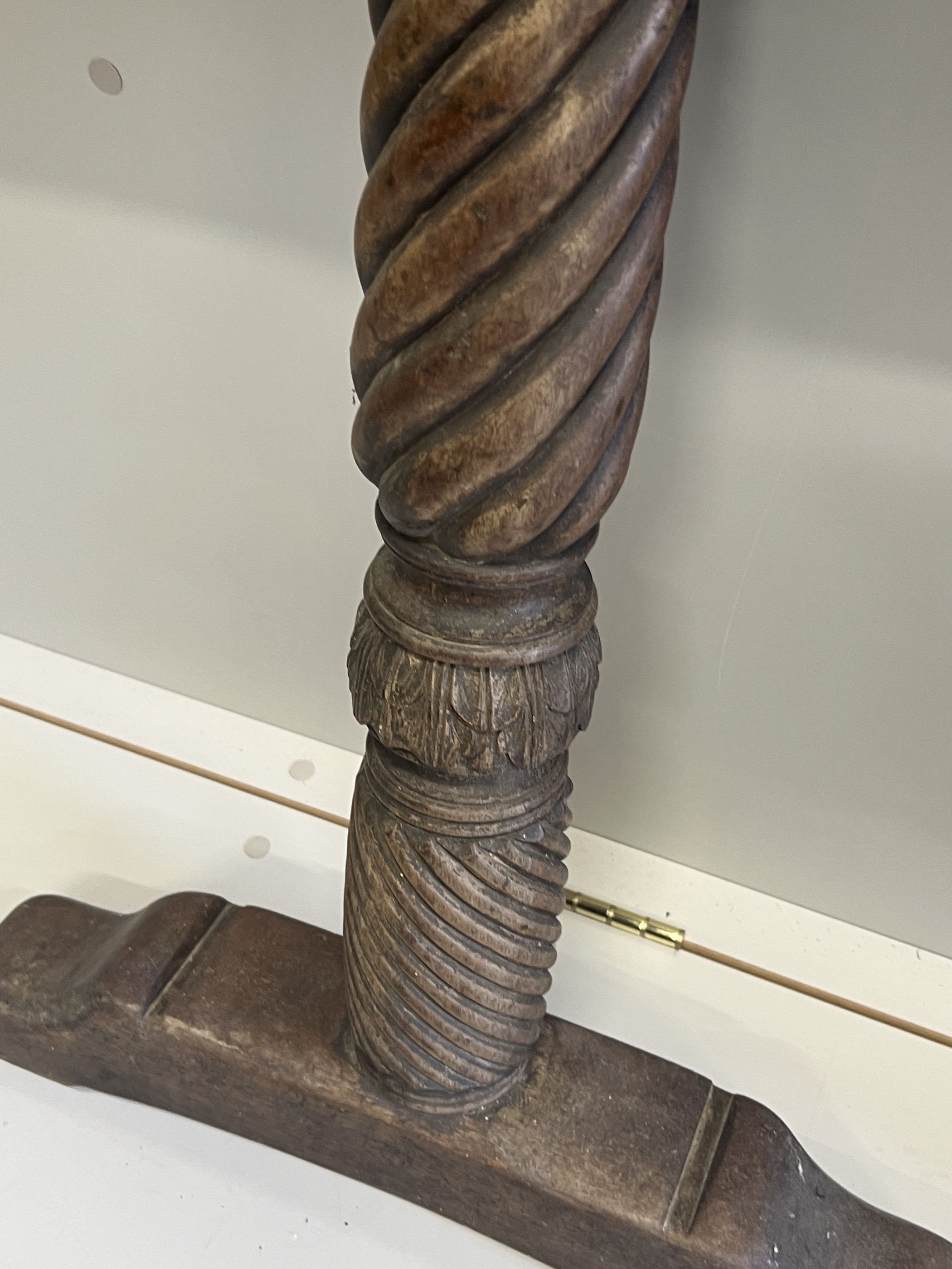 A pair of 17th century oak Wainscot chair arms together with a pair of turned walnut table supports